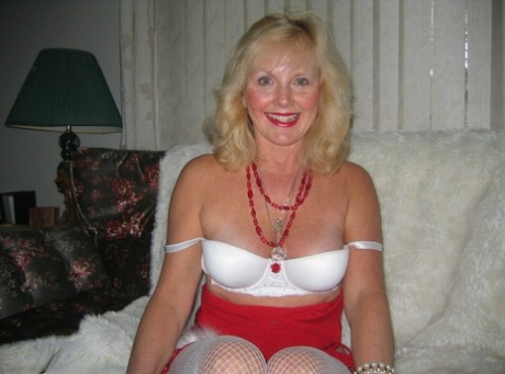 Aged blonde amateur Ruth plays with a cock before getting nude in Xmas hosiery 44929226
