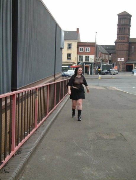 Dark haired pumper wanders about in public in a see-through top 69077914