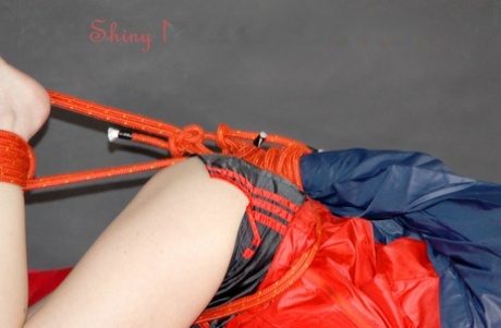 White girl is silenced with a cleave gag while hogtied in nylon clothing 11038885