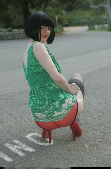 Filthy mature lady in glasses taking off her clothes outdoor 44165609